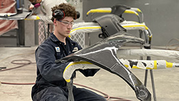 An auto repair student at Skills