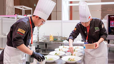 Two alumni competing in Macau