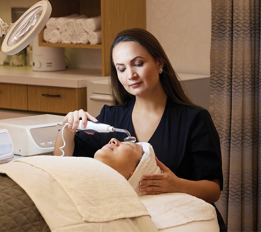 esthetic student giving facial to a customer