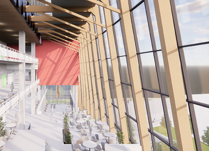 Rendering view of the building interior showing floor to ceiling windows, wood beams and red wall on the far end.