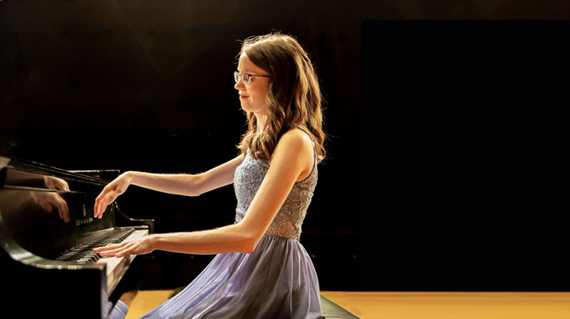 VCC Music department head Emily Logan performing on a piano