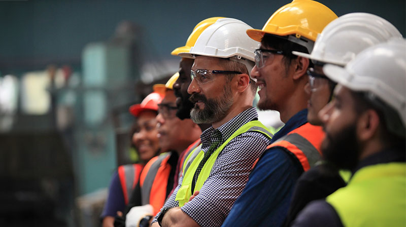 a group of construction workers wearing hard hats