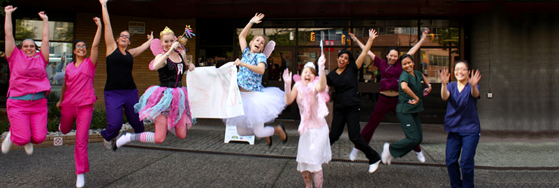 VCC's dental hygiene students jumping together in front of VCC downtown campus.